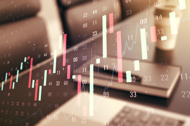 Doble exposición del gráfico financiero creativo abstracto en la investigación de fondo de la computadora portátil moderna y el concepto de estrategia