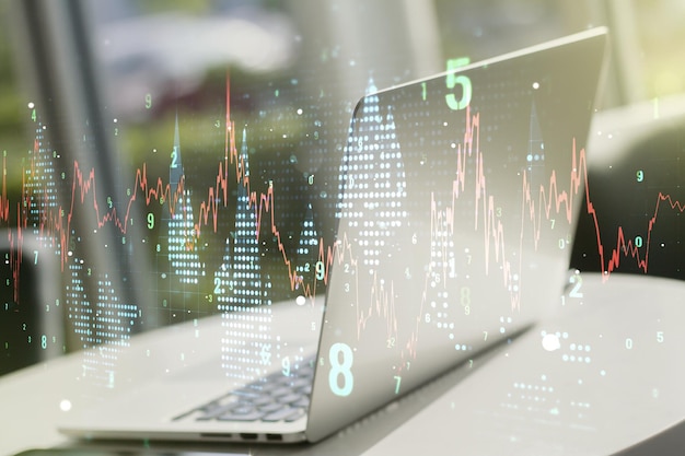 Doble exposición del gráfico financiero creativo abstracto en la investigación de fondo de la computadora portátil moderna y el concepto de estrategia