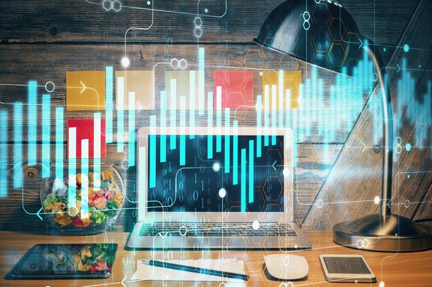 Doble exposición del gráfico forex y espacio de trabajo con computadora Concepto de comercio internacional en línea