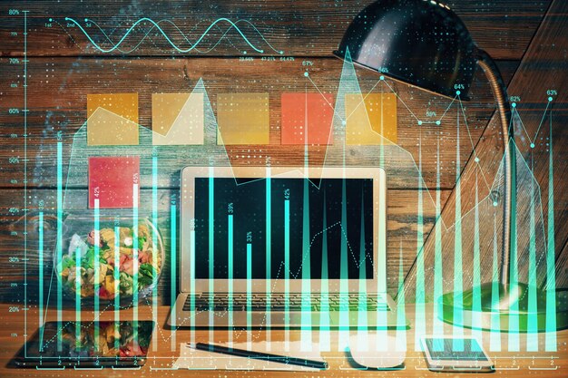 Doble exposición del gráfico forex y espacio de trabajo con computadora Concepto de comercio internacional en línea