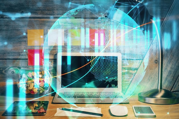 Doble exposición del gráfico forex y espacio de trabajo con computadora Concepto de comercio internacional en línea