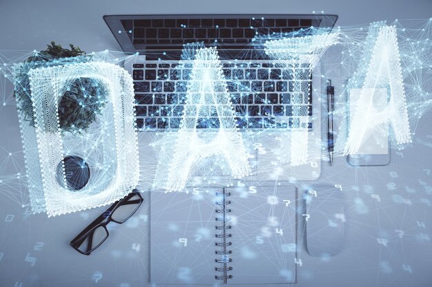 Doble exposición del holograma de dibujo de datos sobre la vista superior del fondo del escritorio de estudio con computadora Concepto de Ai