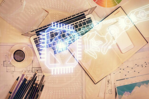 Doble exposición del holograma de dibujo de datos sobre la vista superior del fondo del escritorio de estudio con computadora Concepto de Ai