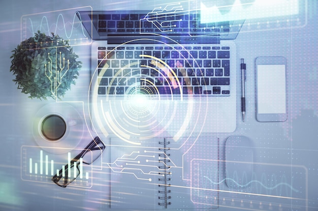Doble exposición del holograma de dibujo de datos sobre la vista superior del fondo del escritorio de estudio con computadora Concepto de Ai