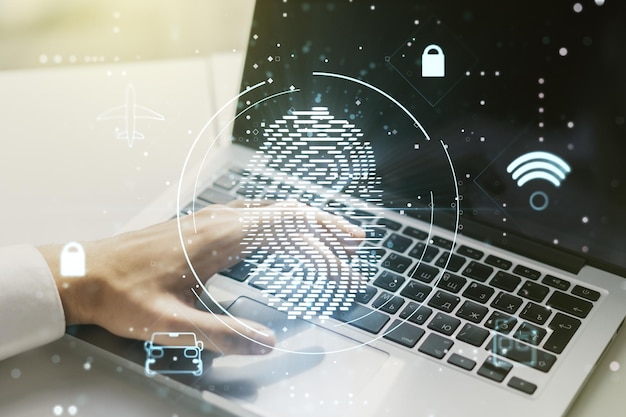 Doble exposición de holograma de huella digital creativa abstracta con manos escribiendo en una computadora portátil en el fondo concepto de protección de la información personal