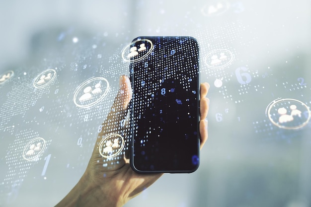Doble exposición de iconos de redes sociales concepto con mapa del mundo y mano con teléfono celular en el fondo concepto de marketing y promoción