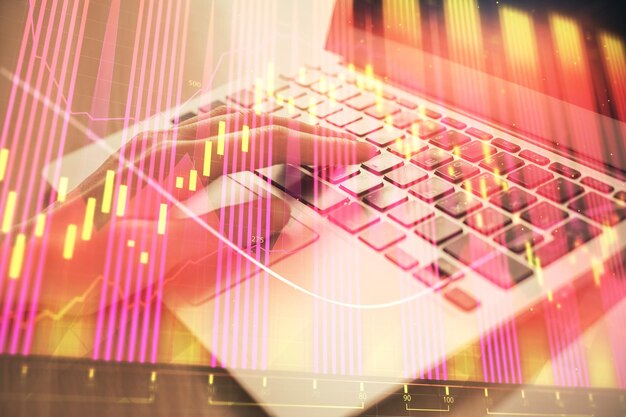 Doble exposición de las manos de la mujer escribiendo en la computadora y dibujo de hologramas de gráficos de divisas Concepto de análisis del mercado de valores