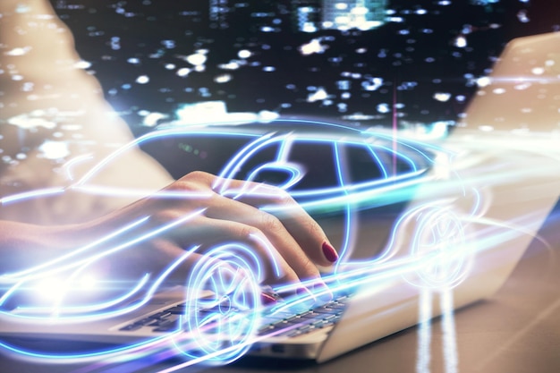 Doble exposición de las manos de la mujer escribiendo en el tema de la computadora y el automóvil dibujando el concepto de alta tecnología