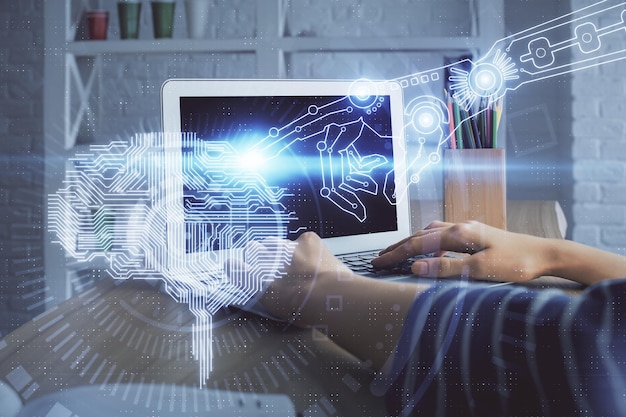Doble exposición de las manos de la mujer trabajando en la computadora y el cerebro dibujando un holograma concepto Ai