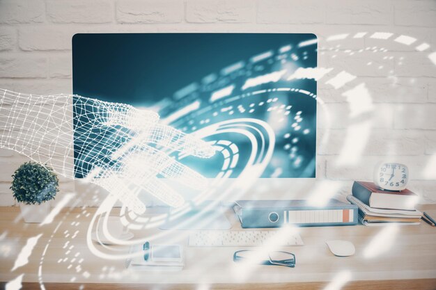Doble exposición de la mesa con la computadora en el fondo y el concepto de tecnología de datos del holograma del tema de los datos