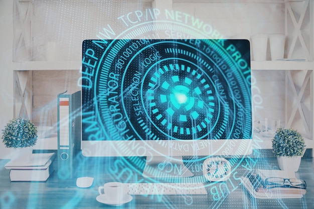 Doble exposición de la mesa con la computadora en el fondo y el concepto de tecnología de datos del holograma del tema de los datos