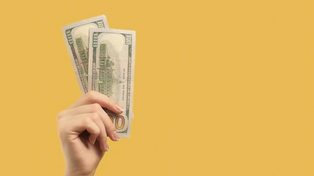 Foto dólar de mão de investimento lucrativo de gesto de dinheiro
