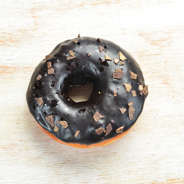 Donut de chocolate dulce en la mesa Pasteles dulces Vista superior