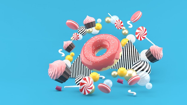 Donut, Cupcakes, Macaron, Süßigkeiten, die zwischen bunten Kugeln auf Blau schweben. 3d rendern