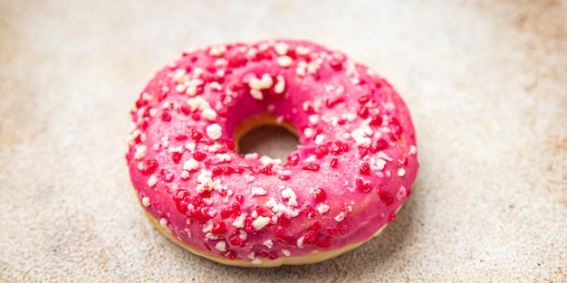 Donut rosa süßes Dessert Essen Snack auf dem Tisch Kopie Raum Essen Hintergrund