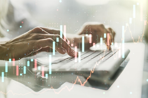 Doppelbelichtung eines abstrakten kreativen Finanzdiagramms mit Handeingabe auf der Computertastatur im Hintergrund Bank- und Buchhaltungskonzept