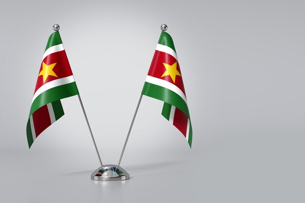 Doppelflagge der Republik Suriname auf grauem Hintergrund 3D-Rendering