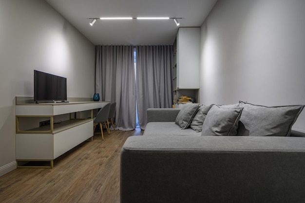 Dormitorio gris de lujo con detalles elegantes y modernos