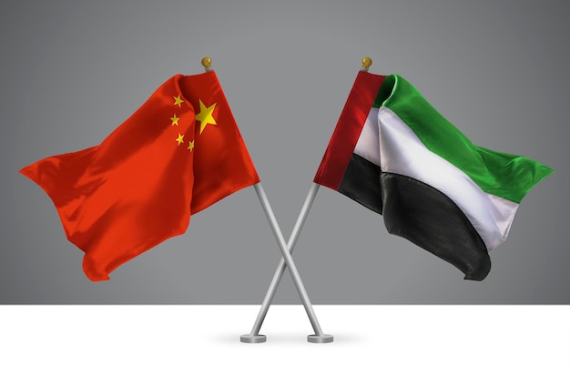 Dos banderas cruzadas de China y Emiratos Árabes Unidos