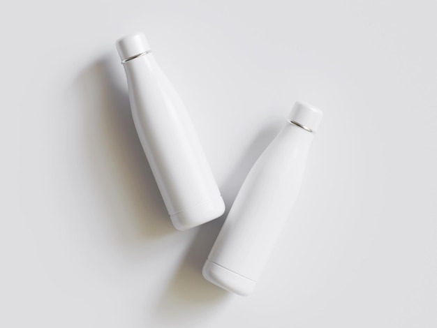 dos botellas blancas de leche están sobre una mesa