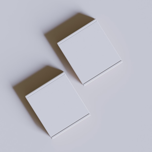 dos cajas están apiladas una encima de la otra una es marrón