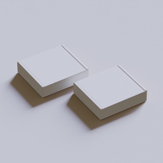 Dos cajas están colocadas una al lado de la otra, una de las cuales es blanca.