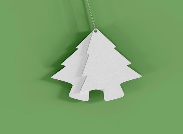 Dos etiquetas de regalo de árbol de Navidad sobre fondo verde. Aislar objetos. representación 3d
