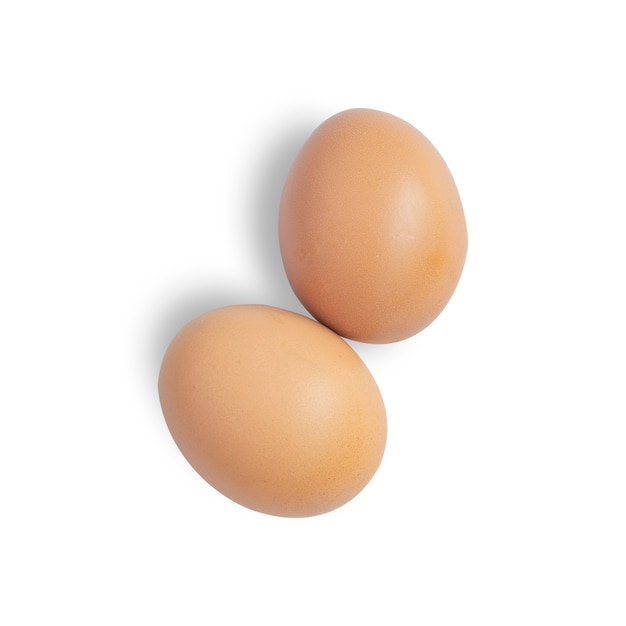 Dos huevos marrones sobre fondo blanco aislado. Parte de recorte de vista superior para uso posterior. para su uso posterior.