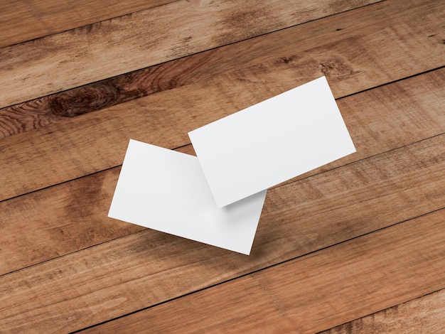 Foto dos maquetas de tarjetas de visita blancas volando sobre el fondo de la mesa de madera, representación 3d