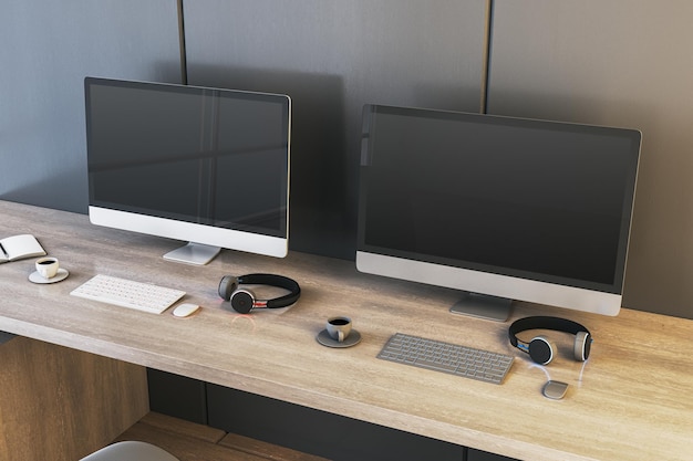 Dos pantallas de computadora de juegos vacías en el escritorio con tazas de café y auriculares Lugar para su anuncio Concepto de club de juegos Mock up Rendering 3D