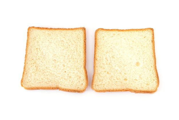 Dos rebanadas de pan blanco sobre un fondo blanco. Pan tostado.