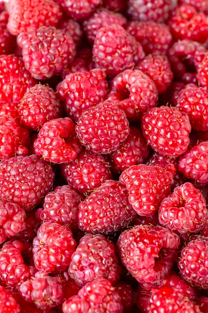 Draufsicht auf reife rote Himbeeren Nahaufnahme Hintergrundtextur