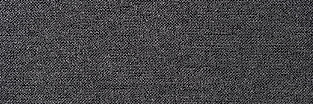 Draufsicht auf weiches und glattes Textilmaterial mit strukturiertem Hintergrund und natürlicher schwarzer Stoffoberfläche