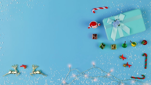 Foto draufsicht der weihnachtsdekorationen auf blauer pastellfarbe