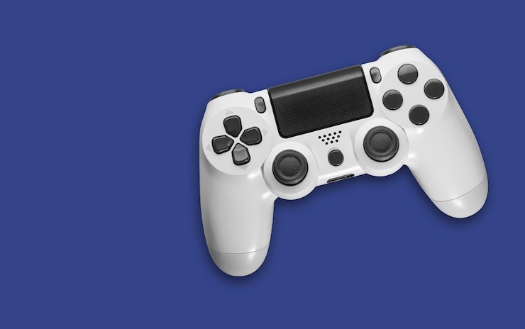 Foto draufsicht des weißen gamecontrollers auf blauem raum