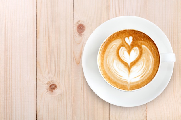 Draufsicht Latte Art Kaffee auf Holz Hintergrund