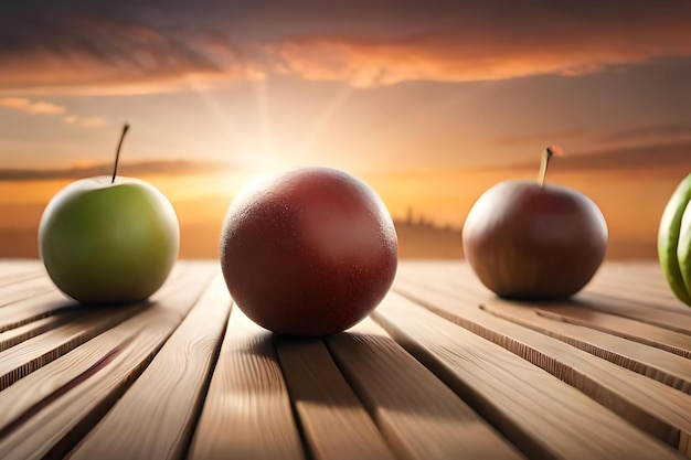 Drei Äpfel auf einem Holztisch mit einem Sonnenuntergang im Hintergrund