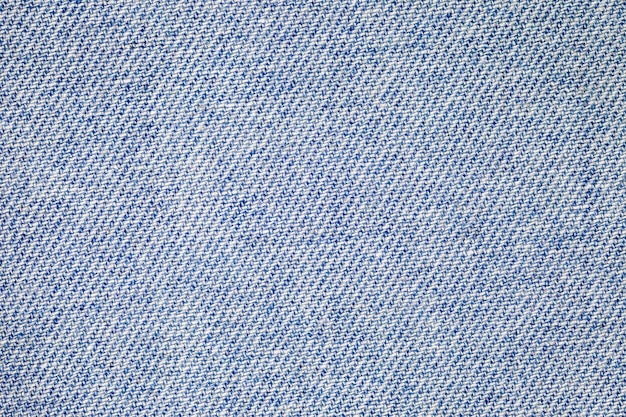 Dril de algodón azul costuras diagonales paño hervido primer plano fondo papel tapiz patrón de textura uniforme