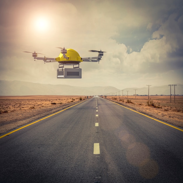 Drone para expediciones vuela sobre un camino aislado en medio del desierto.