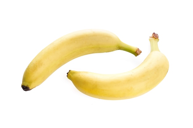 Duas bananas maduras em um fundo branco. Foto de alta qualidade