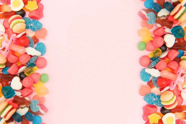 Foto dulces surtidos sobre un fondo de color pastel