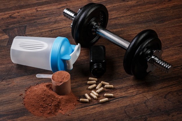 Dumbells e suplementos alimentares