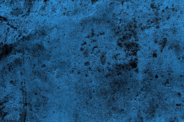 Dunkelblaue Betonwandoberfläche mit schwerer Grunge-Textur für den Hintergrund