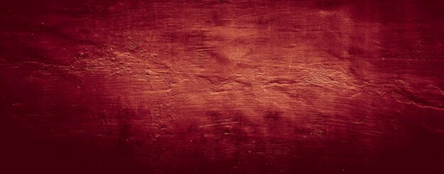 dunkelroter Grunge abstrakter Texturhintergrund der Wandzementbeton