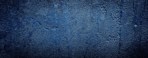 dunkelschwarzer abstrakter blauer texturzementbetonwandhintergrund