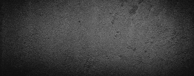 dunkelschwarzer grauer abstrakter betonmauerbeschaffenheitshintergrund