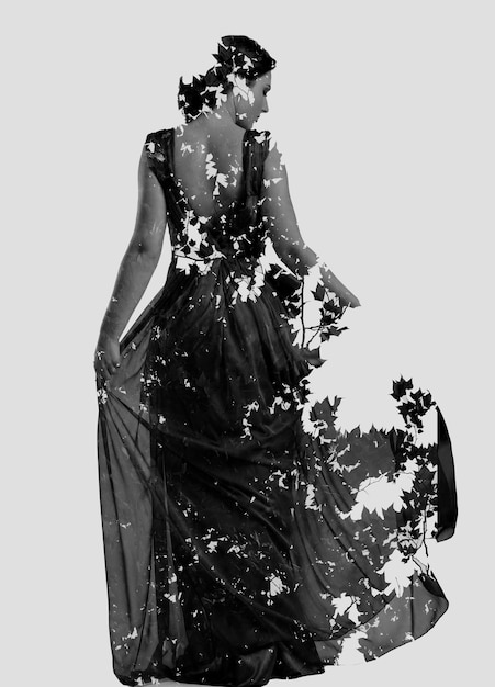 dupla exposição de mulher em vestido de moda com a natureza ramos de árvores de fundo