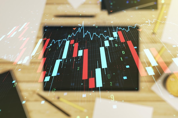 Dupla exposição do gráfico de crise global abstrato criativo com holograma de mapa mundial e tablet digital na visão superior do plano de fundo Crise financeira e conceito de recessão