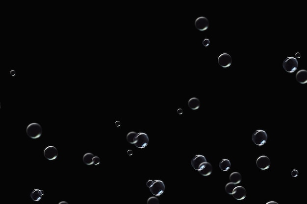 durchsichtige Seifenblasen, überlagerte Muster, abstrakte Partikel, Wasserspritzungen auf Schwarz