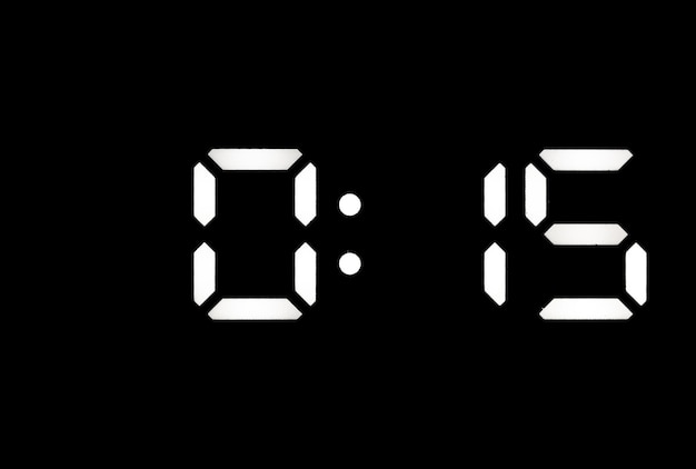 Echte weiße led-digitaluhr auf schwarzem hintergrund